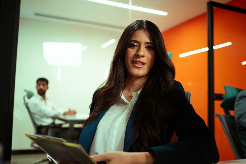 A woman in a meeting room.